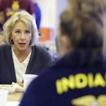 US Secretary of Education Betsy DeVos spoke with Gracie Johnson during a hog roast in Charlottesville, Indiana. 