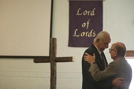 Robert Ferriere (left) of Groton, N.H., got consolation from his old pastor, Anthony Scalfani, after a memorial service for Pamela Ferriere on Saturday at the Rumney Baptist Church in Rumney, N.H.
