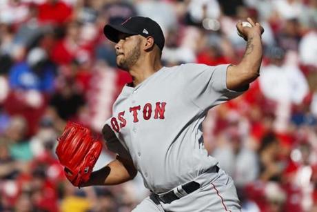 Boston Red Sox starting pitcher Eduardo Rodriguez throws in the first inning of a baseball game against the Cincinnati Reds, Saturday, Sept. 23, 2017, in Cincinnati. (AP Photo/John Minchillo)
