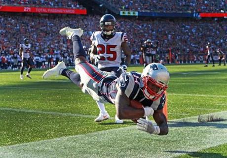 Foxborough, MA: September 24, 2017: Patriots wide reciever Brandin Cooks sails across the goal line as he stayed in bounds to make a great catch to haul in the game winning touchdown late in the fourth quarter on a pass from quarterback Tom Brady (not pictured). The New England Patriots hosted the Houston Texans in a regular season NFL football game at Gillette Stadium. (Jim Davis/Globe Staff). 
