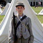 Mikal Madyun, 19, of Providence played the part of a wounded Union soldier during a battle during the Civil War Living History Reenactment at Historic Fort Adams in Newport, R.I.