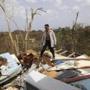 Jose Trinidad observed the ruins of his home in Montebello, Puerto Rico, on Tuesday.