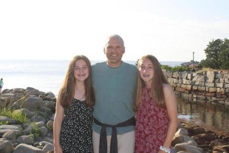 Eric Dahl, with his daughters Casey (left), 12, and Emma, 14.
