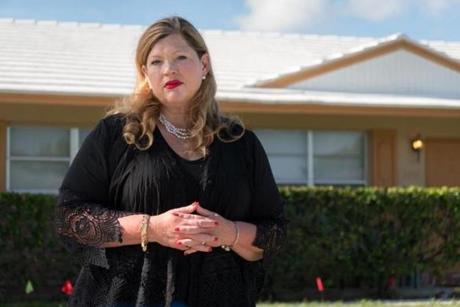Samantha Herring stands in front of a halfway house in Delray Beach where her cousin, Peter San Angelo, 28, was living prior to his death from an opioid drug overdose in October 2016.

