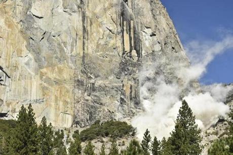 A cloud of dust is seen on El Capitan after a major rock fall in Yosemite National Park. 
