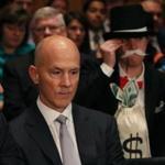 A protester dressed as the ?Monopoly Man? sat behind the former CEO of Equifax.