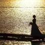 A bride poses for her wedding pictures on a pier along the shore of Lake Paranoa, on the 100th day without rain in Brasilia, Brazil, Wednesday, Aug. 30, 2017. The capital's drought record occurred in 1963, when the capital was without rain for 164 days, or about five months. (AP Photo/Eraldo Peres)