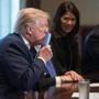 President Donald Trump kissed a sample of the proposed new tax form as he meets with House Republican leaders and Republican members of the House Ways and Means Committee at the White House on Thursday.