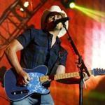 FILE - In this June 27, 2015 file photo, Brad Paisley performs during day two of the 2015 FarmBorough Music Fest in New York. Paisley, the co-host of the Country Music Association Awards, is calling on the organization to rescind media restrictions barring reporters from asking about the mass shooting in Las Vegas, gun rights or political affiliations at the awards show. Paisley tweeted Friday, Nov. 3, 2017, that he?s sure the CMA ?will do the right thing and rescind these ridiculous and unfair press guidelines? (Photo by Andy Kropa/Invision/AP, File)