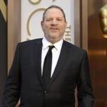 FILE - In this March 2, 2014 file photo, Harvey Weinstein arrives at the Oscars in Los Angeles. Day by day, the accusations pile up, as scores of women come forward to say they were victims of Weinstein. But others with stories to tell have not. For some of these women who?ve chosen not to go public, the fear of being associated forever with the sordid scandal _ and the effects on their careers, and their lives _ might be too great. Or they may still be struggling with the lingering effects of their encounters. (Photo by Jordan Strauss/Invision/AP, File)