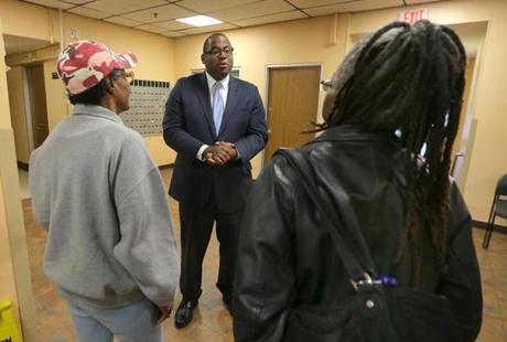 Boston, MA - 11/6/2017 - Boston City Councilor Tito Jackson (cq) campaigns for mayor, in the lobby of the Saint Botolph Apartments (cq). He talks to residents Phyllis Calvey (cq), left, and Janice Lee (cq). (Pat Greenhouse/Globe Staff) Topic: 07mayoral-TJ Reporter: Meghan Irons
