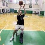 November 7, 2017-Waltham, Ma- Stan Grossfeld/Globe Staff-Embargoed until November 10-Injured Celtic Gordon Hayward shoots baskets from a chair infront of the foul line.