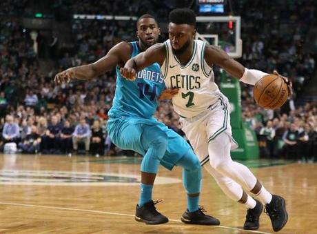 Boston Ma 11/10/17 Boston Celtics Jaylen Brown drives to the basket on Charlotte Hornets Michael Kidd-Gilchrist during second quarter action at the TD Garden. (Matthew J. Lee/Globe staff) topic reporter: 
