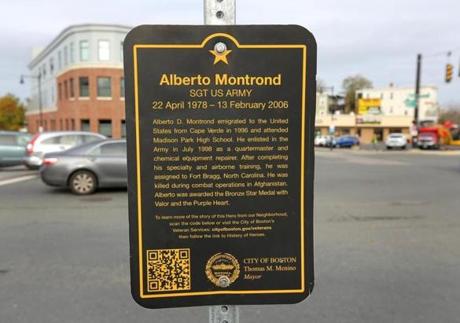 The plaque honoring Army Sergeant Alberto Montrond tells visitors to his hero square about his biographical information.
