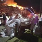 Residents of the Barclay Friends Senior Living Community waited for ambulances as the senior care facility burned in a massive fire nearby. 