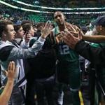 Boston, MA: 11-16-17: The Celtics Al Horford gets a lot of hands from the fans as he leaves the court following Boston's victory. The Boston Celtics hosted the Golden State Warriors in a regular season NBA basketball game at the TD Garden. (Jim Davis/Globe Staff)