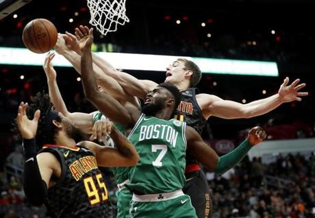 Jaylen Brown (7) reached for a rebound with teammate Aron Baynes nearby in Saturday?s 110-99 victory. 
