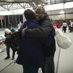 Outgoing City Councilor Tito Jackson hugged a woman who lined up for one of the 3,000 turkeys he gave away on Sunday to members of the community.