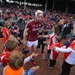 Kids lined up to welcome to welcome the Galway team onto the Fenway Park field on Sunday during the Players Champions Cup.