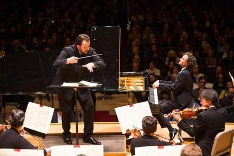 Andris Nelsons leading pianist Martin Helmchen and the BSO last week.
