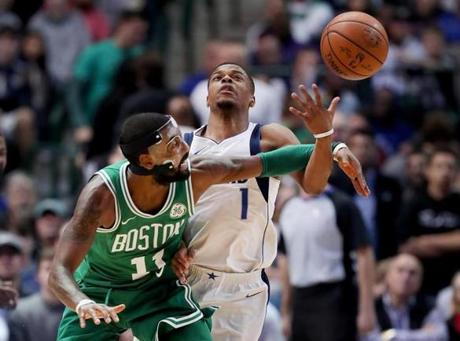 Celtics guard Kyrie Irving tried to swipe the ball away from Mavericks guard Dennis Smith Jr.
