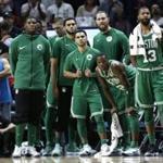 Boston Celtics' Terry Rozier, second from right, and Marcus Morris (13) watch during the second half of an NBA basketball game against the Miami Heat, Wednesday, Nov. 22, 2017, in Miami. The Heat won 104-98. (AP Photo/Lynne Sladky)