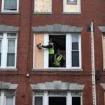 11/22/2017 Boston - Ma -. Workers board up windows at 282 Hanover Street in Boston's North End. Their was a tragic fire in building that killed two people. Jonathan Wiggs\Globe Staff Reporter:Topic. 