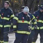Braintree, MA -- 12/15/2016 - Firefighters return from the scene where one worker was rescued and one worker was killed at a water tower. (Jessica Rinaldi/Globe Staff) Topic: 16braintreepic Reporter: Andy Rosen