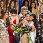 Demi-Leigh Nel-Peters of South Africa was congratulated by fellow contestants after being named Miss Universe 2017.