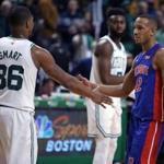 Boston, MA: 11-27-17: Former Celtics guard Avery Bradley (right) returned to Boston with his new team the Detroit Pistons tonight. Bradley and former teammate and close friend Marcus Smart (left) shake hands before they embrace following the Pistons victory. The Boston Celtics hosted the Detroit Pistons in a regular season NBA basketball game at TD Garden. (Jim Davis/Globe Staff)
