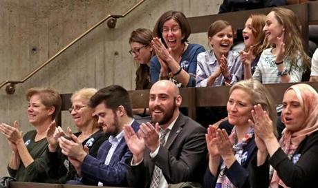 Audience members applauded after Boston City Council passed a ban on single-use plastic bags.
