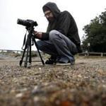 Jason Torres, of Mason, N.H., uses his camera to search for evidence of the Earth?s curvature. He says he hasn?t found any.