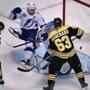Boston, MA: 11-29-17: Tampa Bay's Tyler Johnson (9), trips over his goalie Andrei Vasilevskiy, as a first period shot by the Bruins Charlie McAvoy (not pictured) crosses the goal line. The play was originally called a no goal, but after a video review, the call was reversed and Boston led 1-0. The Bruins Brad Marchand is at right. The Boston Bruins hosted the Tampa Bay Lightning in a regular season NHL hockey game at TD Garden. (Jim Davis/Globe Staff)
