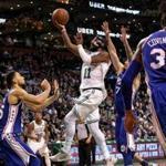 Boston, MA - 11/30/2017 - (4th quarter) Boston Celtics guard Kyrie Irving (11) drives and puts up a high floater good for two and a 99-87 lead on this drive during the fourth quarter. The Boston Celtics host the Philadelphia 76ers at TD Garden. - (Barry Chin/Globe Staff), Section: Sports, Reporter: Adam Himmelsbach, Topic: 01Celtics-76ers, LOID: 8.4.190246640