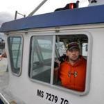 Lobsterman Tom Tomkiewicz, on his boat at Union Wharf in Fairhaven, said he is trapping in deeper, colder waters.