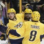 Nashville Predators left wing Kevin Fiala (22), of Switzerland, celebrates with P.K. Subban (76) and Kyle Turris (8) after Fiala scored a goal against the Boston Bruins in the second period of an NHL hockey game Monday, Dec. 4, 2017, in Nashville, Tenn. (AP Photo/Mark Humphrey)