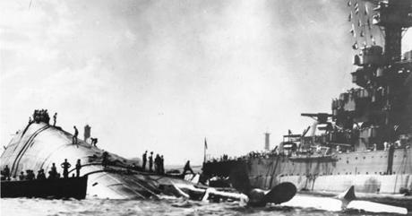 
Nacy personnel inspected the capsized USS Oklahoma after the Japanese attack on Pearl Harbor in Hawaii in 1941. 

