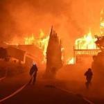 Firefighters worked to put out a blaze burning homes on Tuesday in Ventura, Calif. 
