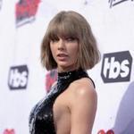 FILE - In this April 3, 2016 file photo, Taylor Swift arrives at the iHeartRadio Music Awards at The Forum in Inglewood, Calif. David Mueller, a former radio DJ who was ordered to pay a symbolic $1 to Swift for groping her at a photo op, says he mailed her a Sacagawea coin last week. Mueller provided a letter to The Associated Press showing the payment was sent Nov. 28, 2017. In a story published Wednesday, Dec. 6, Swift said she hadn't received the dollar. (Photo by Richard Shotwell/Invision/AP, File)