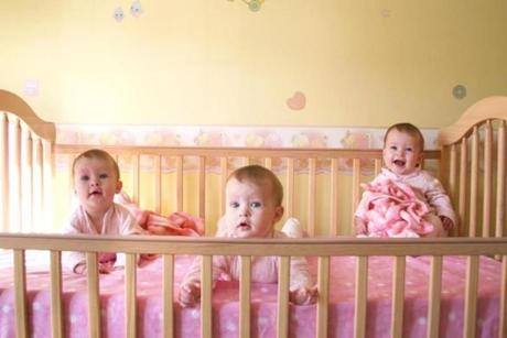 Little Baby Girls in crib together 
