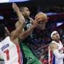Celtics forward Al Horford split the Pistons? defense on a drive to the basket during the first half.