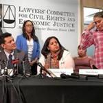 Attorneys Rachel Smit and Sophia Hall (from left, standing) and Ivan Espinoza of the Lawyers Committee for Civil Rights and Economic Justice joined the plaintiffs Tuesday.