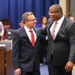 Tito Jackson (right) put his arm around Sal LaMattina as they walked to their seats in the City Council chamber Wednesday.