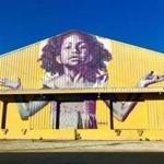  A mural by New Orleans street artist Brandan Odums on the outside of Studio Be