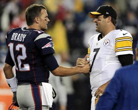 FILE - In this Sept. 10, 2015, file photo, New England Patriots quarterback Tom Brady, left, speaks with Pittsburgh Steelers quarterback Ben Roethlisberger before an NFL football game in Foxborough, Mass. So while Sunday's contest at Heinz Field will almost certainly decide the top seed in the AFC, it's not exactly Ali-Frazier, two undefeated heavyweights facing off, even with Tom Brady and Ben Roethlisberger on hand. (AP Photo/Charles Krupa, File)
