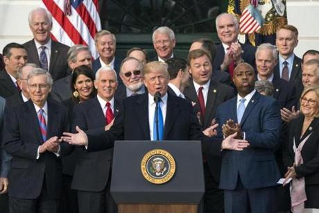 Mandatory Credit: Photo by JIM LO SCALZO/EPA-EFE/REX/Shutterstock (9298766j) Donald J. Trump Trump, Senate Republicans hold rally after passage of tax plan, Washington, USA - 20 Dec 2017 US President Donald J. Trump, joined by Republican members of the House and Senate, speaks about the passage of the Republican tax plan on the South Lawn of the White House in Washington, DC, USA 20 December 2017. The President is expected to sign the bill in January.
