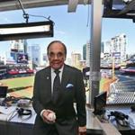 FILE - In this Sept. 29, 2016, file photo, Dick Enberg, the voice of the San Diego Padres, poses in his booth prior to the Padres' final home baseball game of the season in San Diego. Enberg, the sportscaster who got his big break with UCLA basketball and went on to call Super Bowls, Olympics, Final Fours and Angels and Padres baseball games, died Thursday, Dec. 21, 2017. He was 82. Engberg's daughter, Nicole, confirmed the death to The Associated Press. She said the family became concerned when he didn't arrive on his flight to Boston on Thursday, and that he was found dead at his home in La Jolla, a San Diego neighborhood. (AP Photo/Lenny Ignelzi, File)