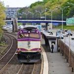 An inbound commuter rail train on the Framingham/Worcester line pulls into the Newtonville MBTA station.