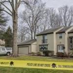 Police tape cordoned off the Reston, Va., home where Buckley Kuhn-Fricker and her husband, Scott Fricker, were killed Friday.
