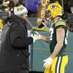Green Bay Packers' Aaron Rodgers shakes hands with Jordy Nelson before an NFL football game against the Minnesota Vikings Saturday, Dec. 23, 2017, in Green Bay, Wis. (AP Photo/Mike Roemer)